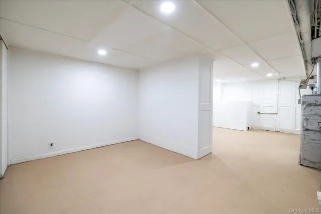 an empty room with a kitchen