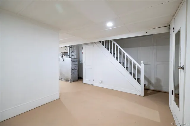 a view of an empty room with stairs