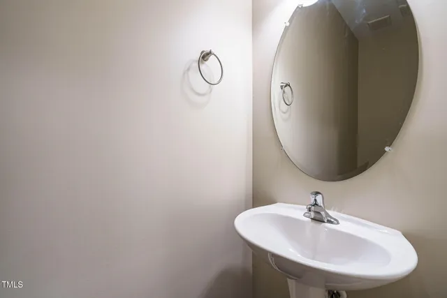 a kitchen with stainless steel appliances granite countertop wooden cabinets granite counter tops and a window