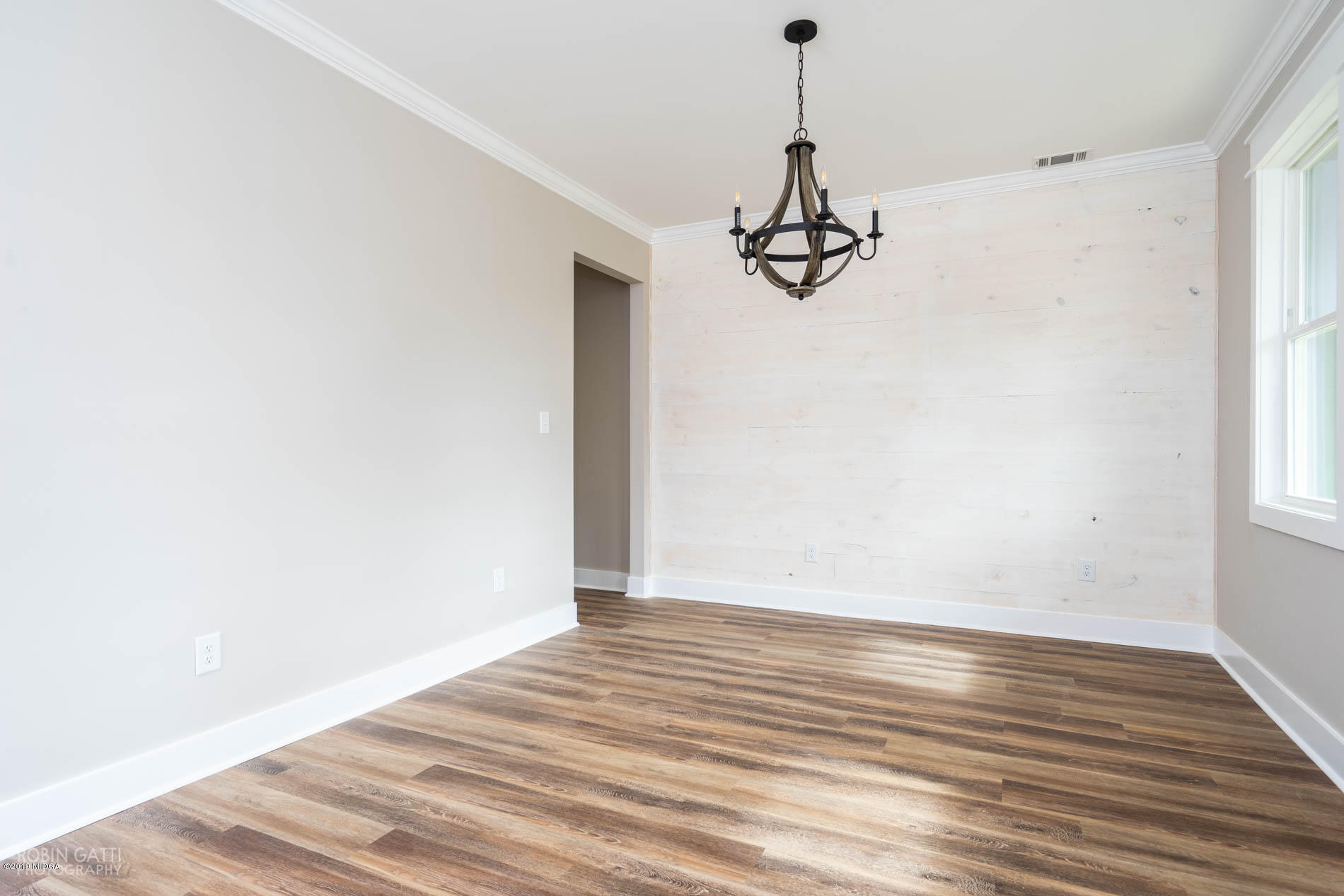 2281 Reedy Creek Road Forsyth, GA 31029 - Photo 3 of 35 a view of a room with wooden floor ceiling fan and window