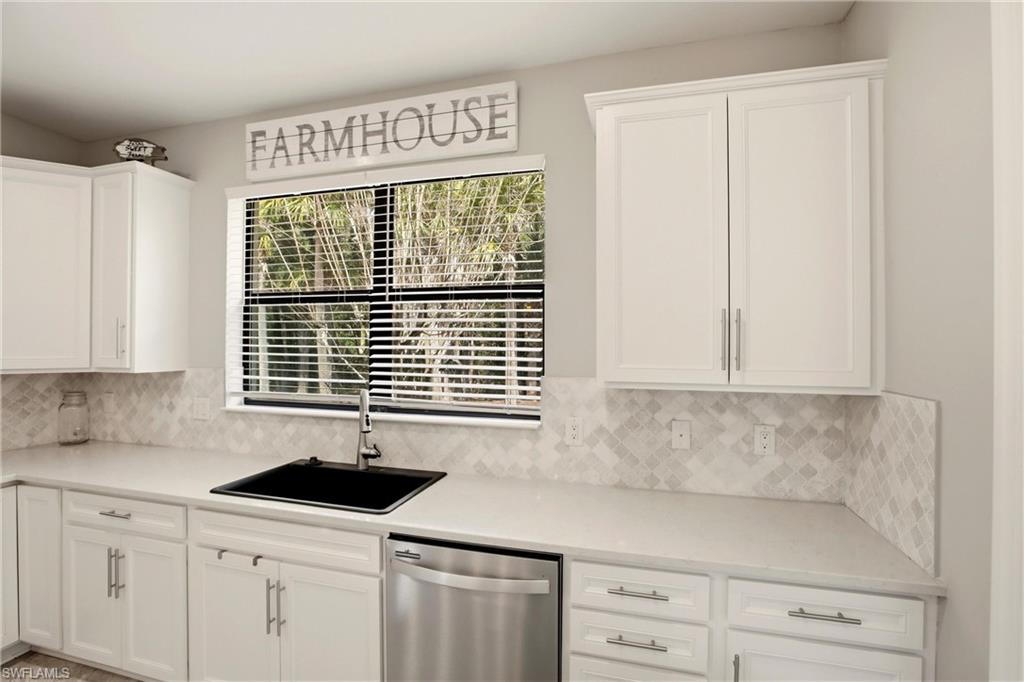 11216 Carlingford Road Fort Myers, FL 33913 - Photo 12 of 38 a kitchen with granite countertop white cabinets and a sink