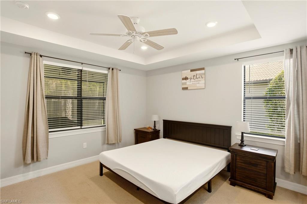 11216 Carlingford Road Fort Myers, FL 33913 - Photo 18 of 38 a bedroom with a bed and window