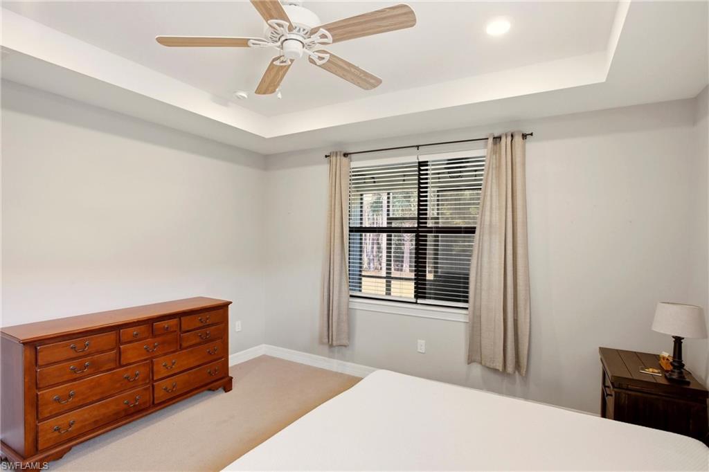 11216 Carlingford Road Fort Myers, FL 33913 - Photo 20 of 38 a bedroom with a bed and wooden floor