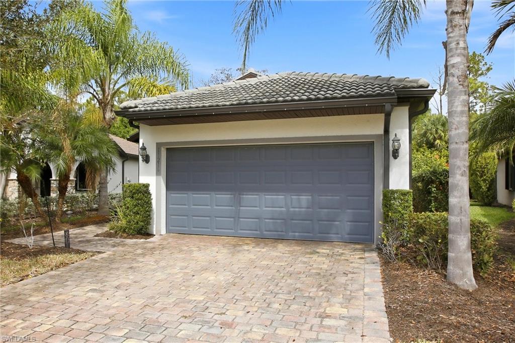 11216 Carlingford Road Fort Myers, FL 33913 - Photo 2 of 38 a front view of a house