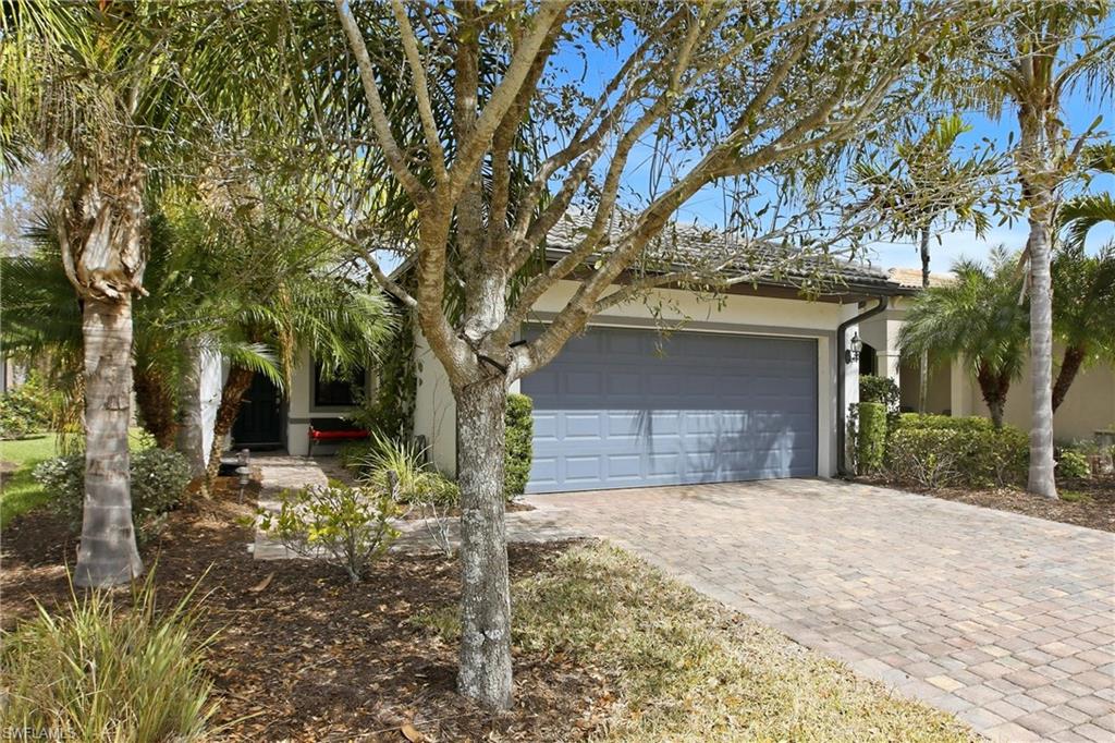 11216 Carlingford Road Fort Myers, FL 33913 - Photo 3 of 38 a front view of a house with a yard and garage