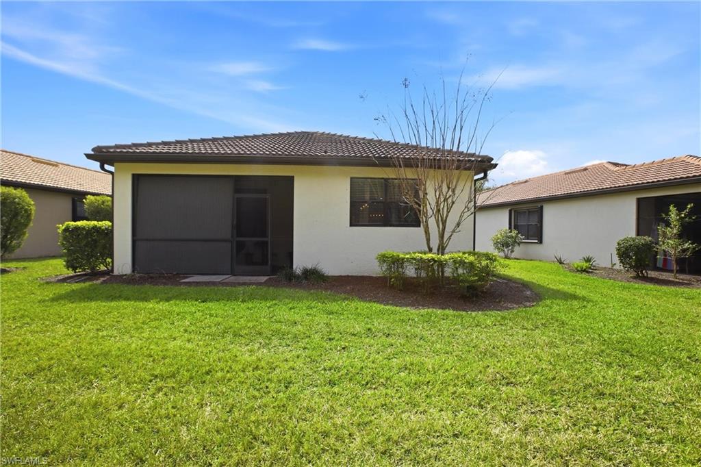 11216 Carlingford Road Fort Myers, FL 33913 - Photo 35 of 38 a view of a house with a yard