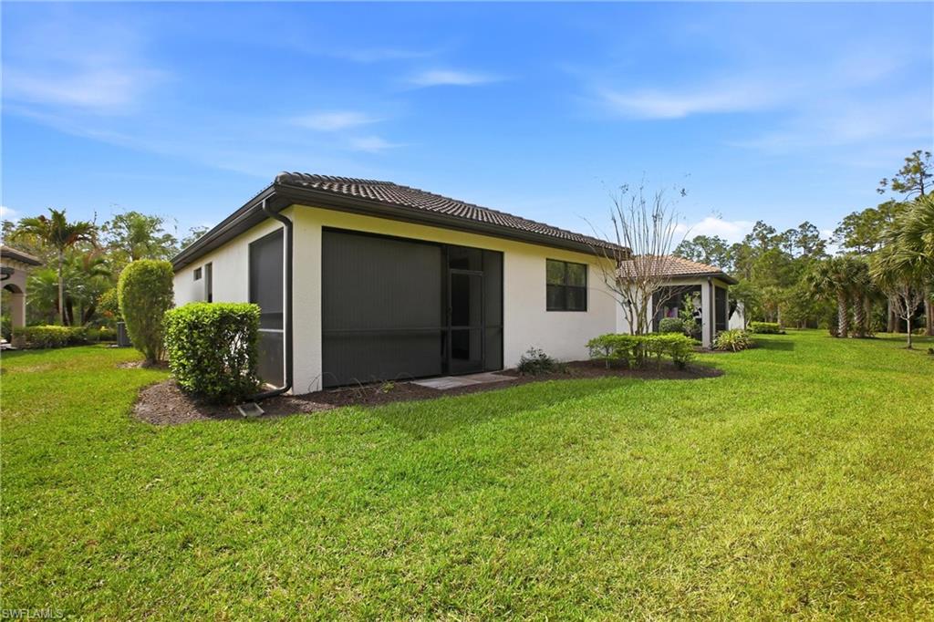 11216 Carlingford Road Fort Myers, FL 33913 - Photo 36 of 38 a front view of a house with garden