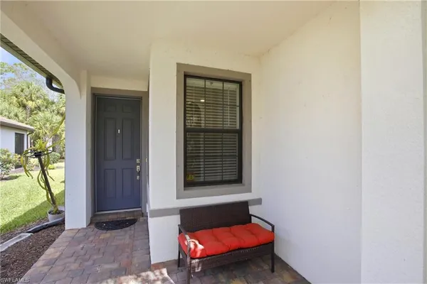a room with furniture and a window