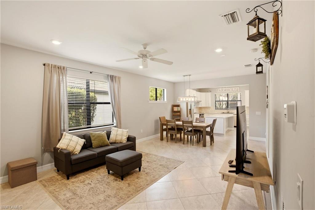 11216 Carlingford Road Fort Myers, FL 33913 - Photo 8 of 38 a living room with furniture and a large window