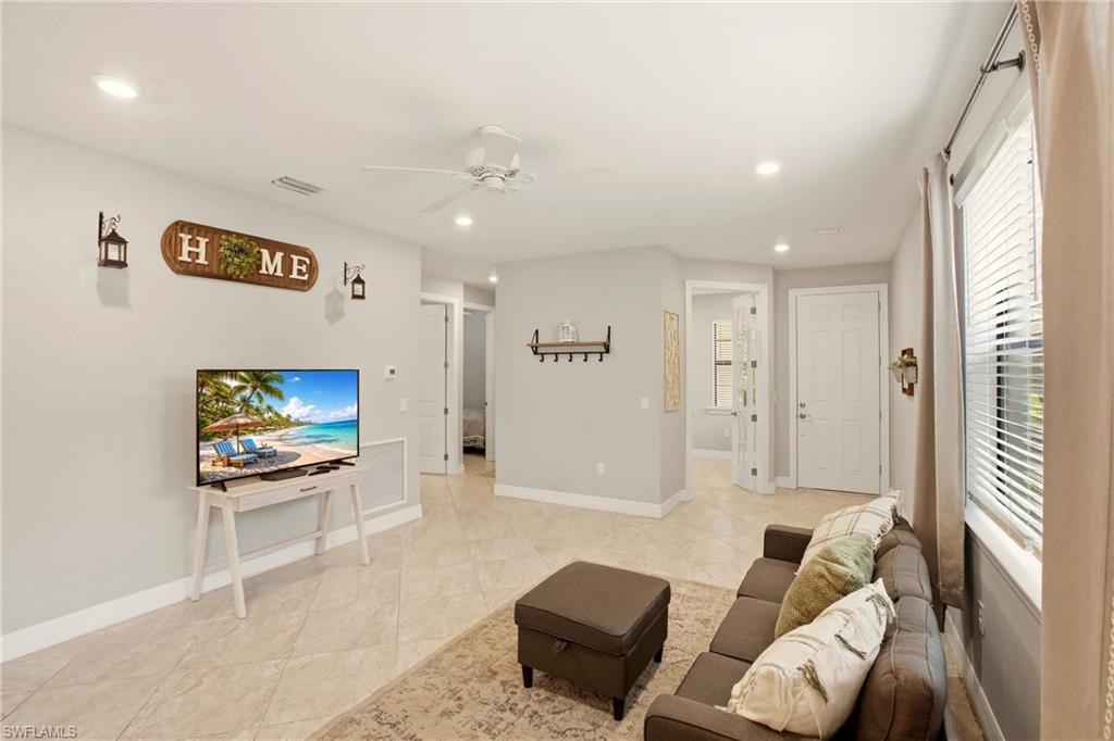 11216 Carlingford Road Fort Myers, FL 33913 - Photo 10 of 38 a living room with furniture and a flat screen tv
