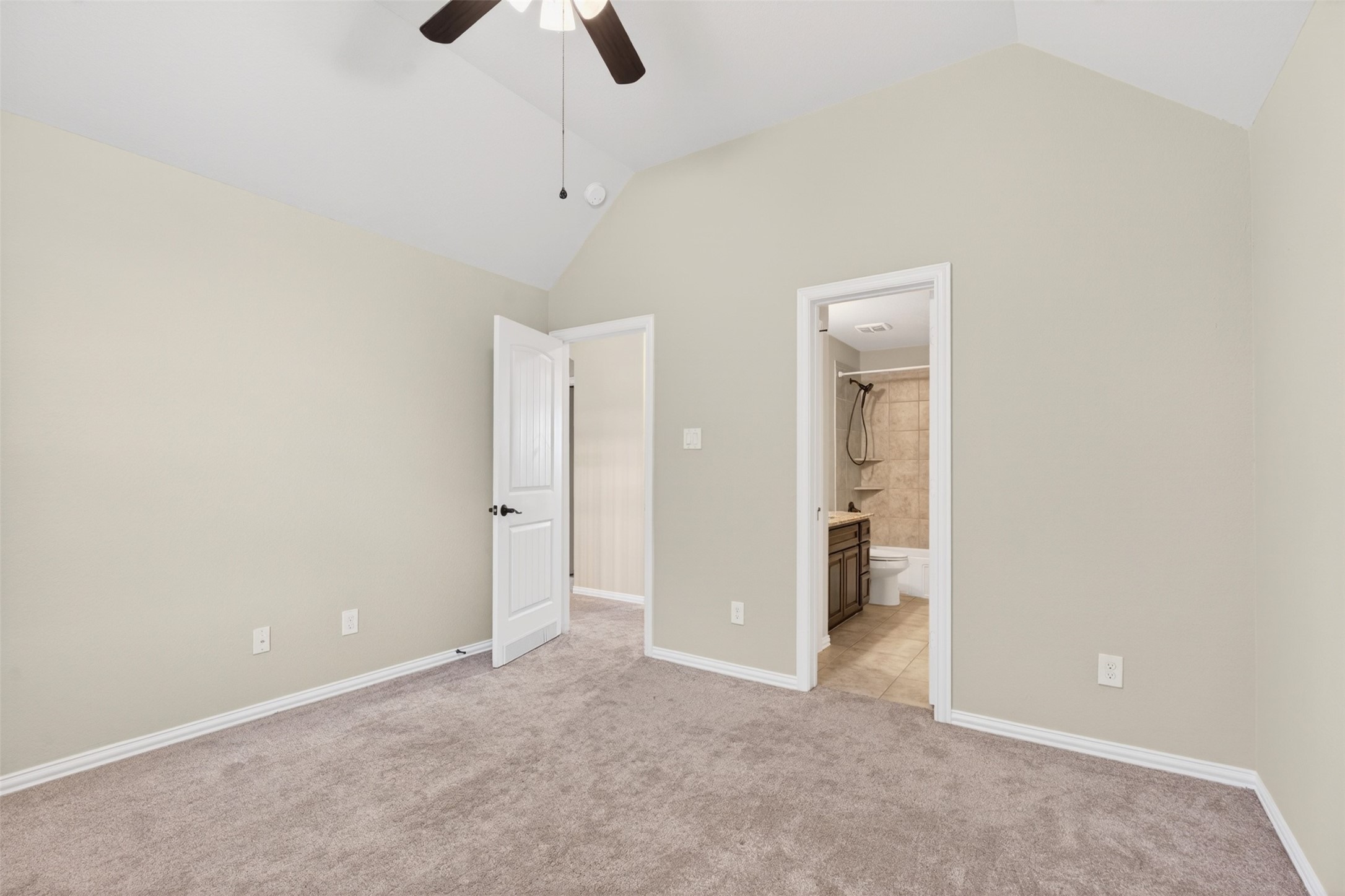 18202 Wedgewood Bluff Court Spring, TX 77379 - Photo 38 of 50 Secondary bedroom angle showing closet access and neutral carpet.