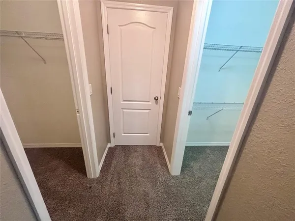 a bathroom with a tub shower and a sink