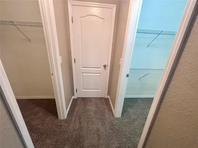 a bathroom with a tub shower and a sink