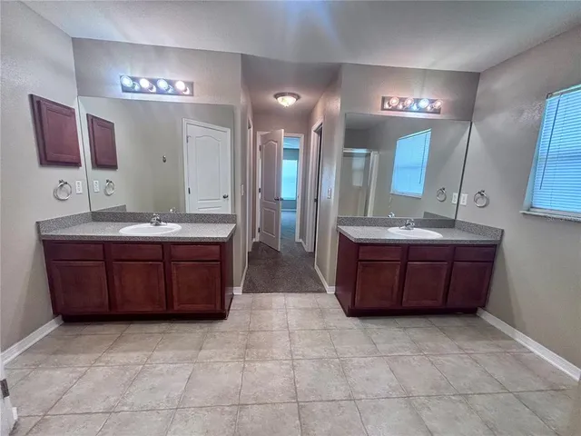 a bathroom with a sink a toilet and bathtub