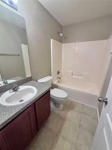 an empty room with a bathroom