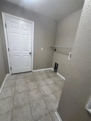 a view of a livingroom with wooden floor and a sink