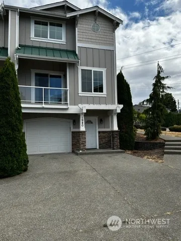 a front view of a house with a garage