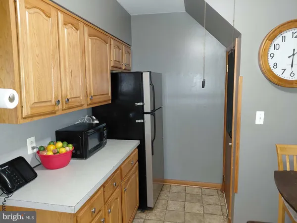a kitchen with a stove and a refrigerator