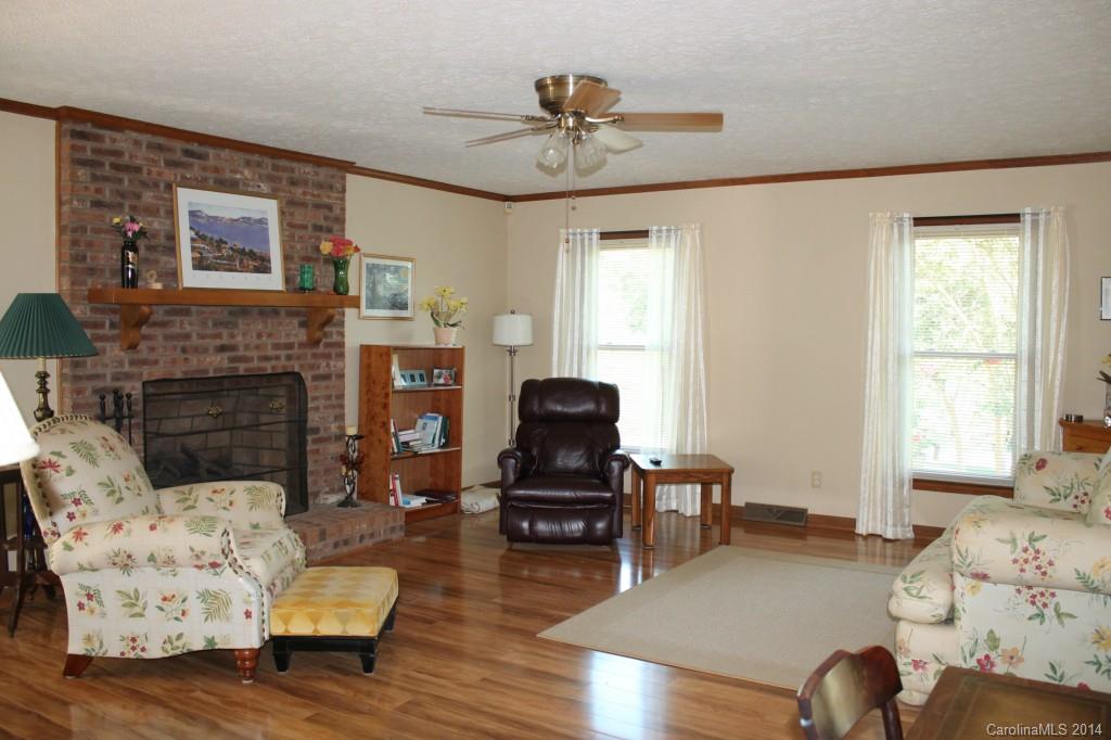 3147 Horseshoe Trail Fort Mill, SC 29708 - Photo 3 of 12 a living room with furniture a fireplace and a large window