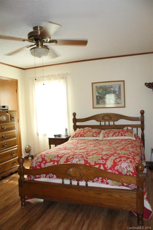 3147 Horseshoe Trail Fort Mill, SC 29708 - Photo 6 of 12 a bedroom with a bed and wooden floor