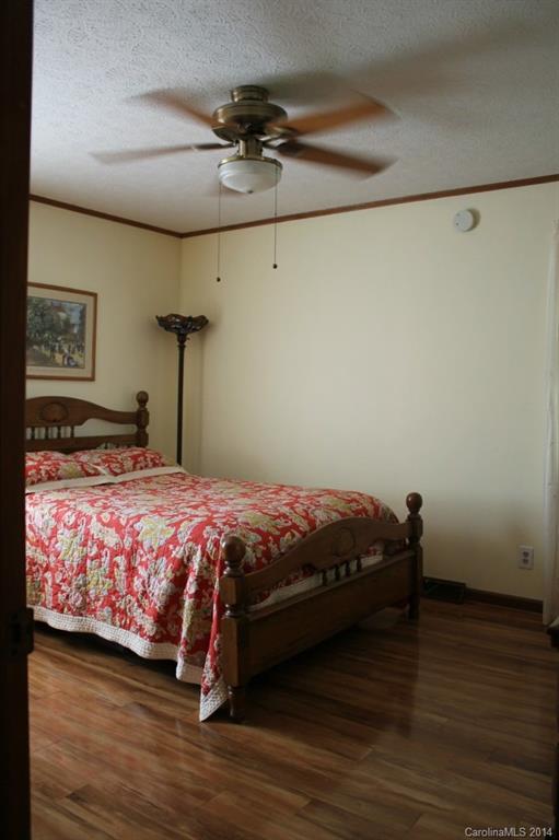3147 Horseshoe Trail Fort Mill, SC 29708 - Photo 8 of 12 a bedroom with a bed and wooden floor