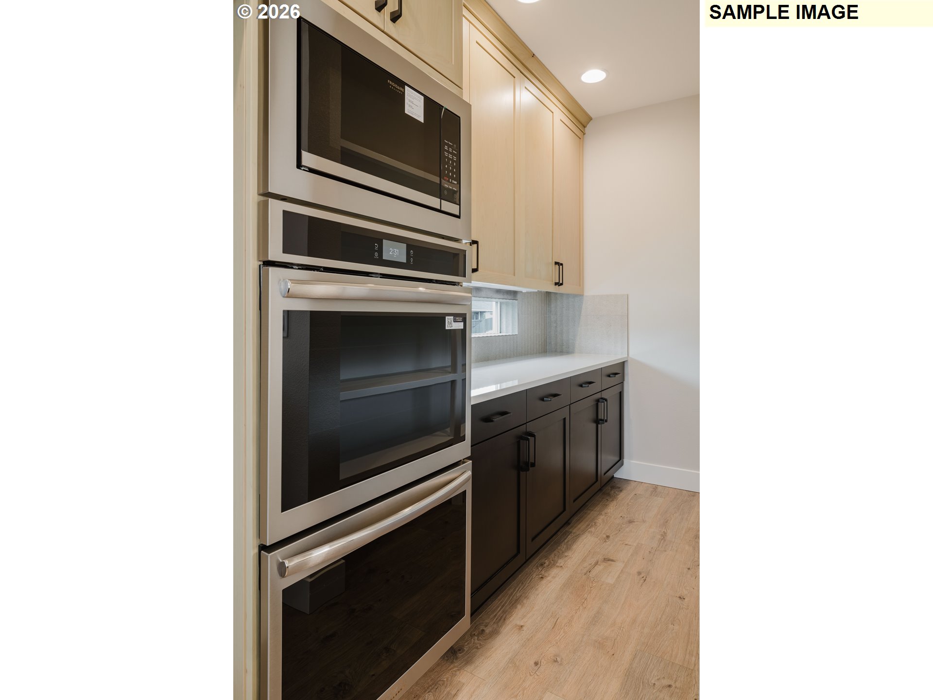 1403 North 41st Place Ridgefield, WA 98642 - Photo 12 of 30 a kitchen with a stove and a microwave