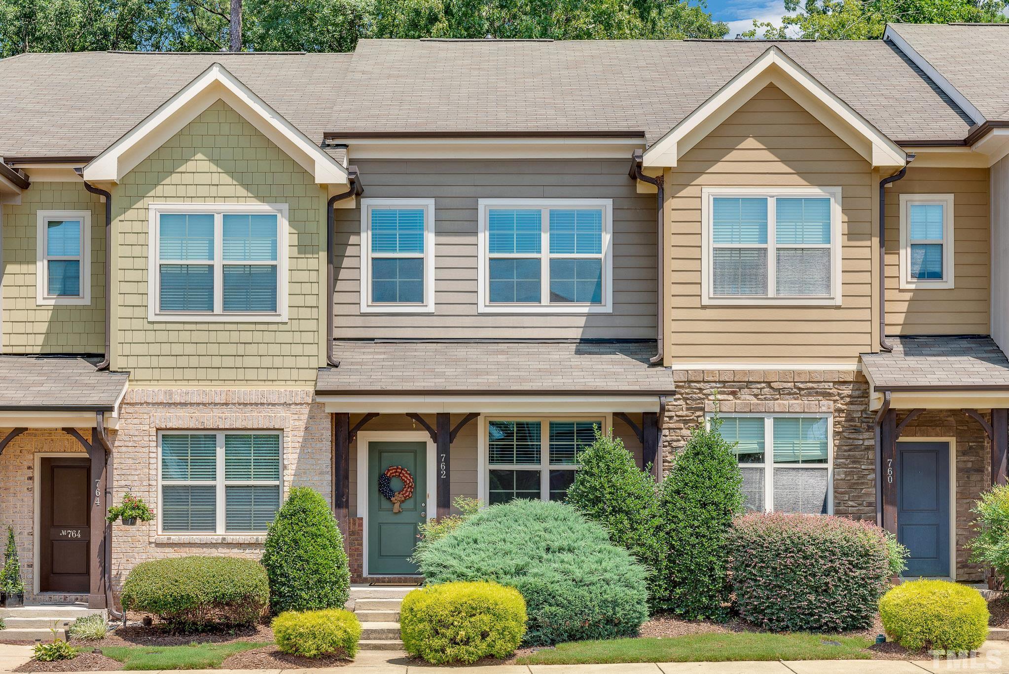 762 Wickham Ridge Road Apex, NC 27539 - Photo 1 of 32 front view of a house and a yard