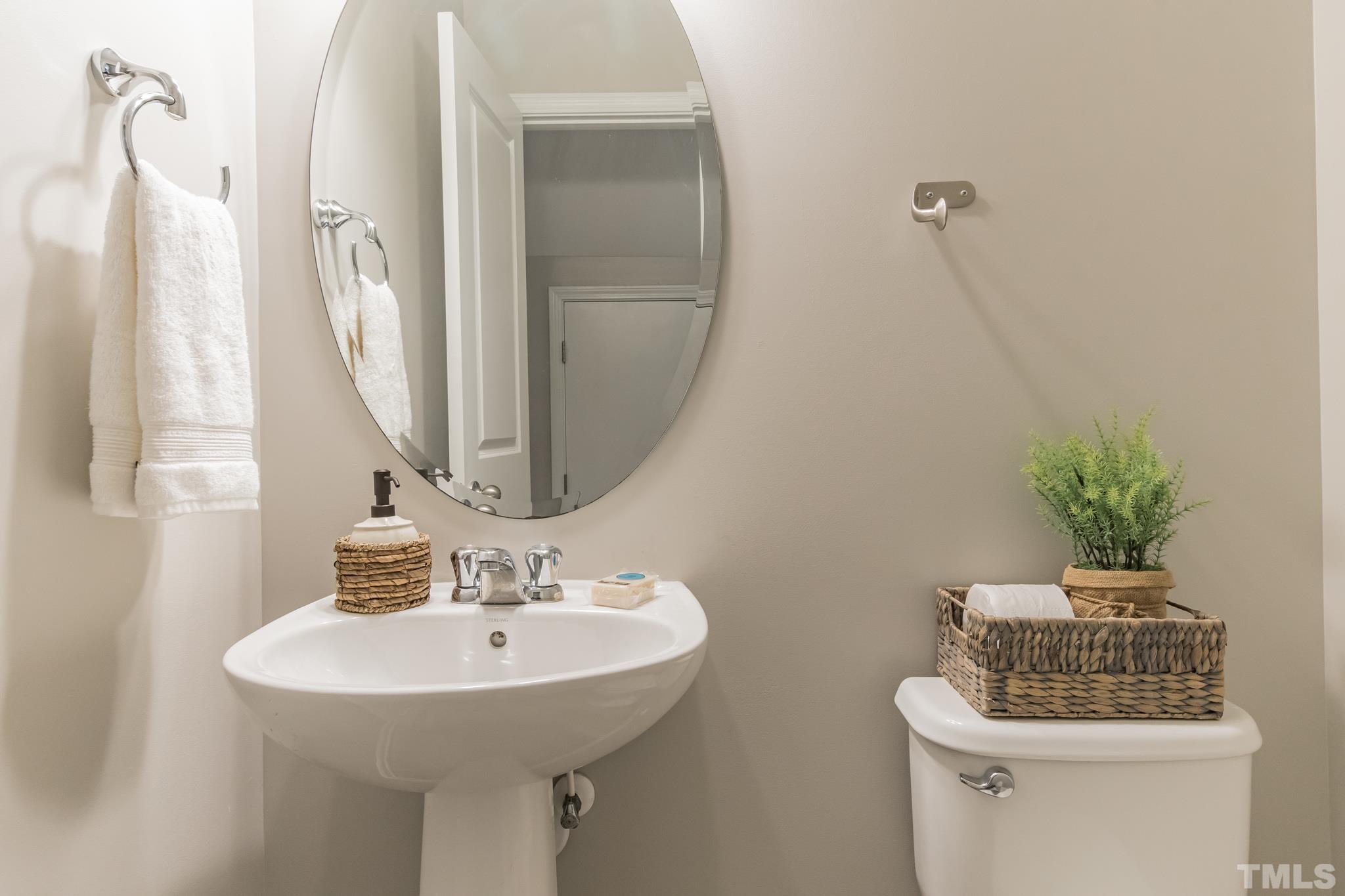 762 Wickham Ridge Road Apex, NC 27539 - Photo 15 of 32 a bathroom with a sink and a mirror