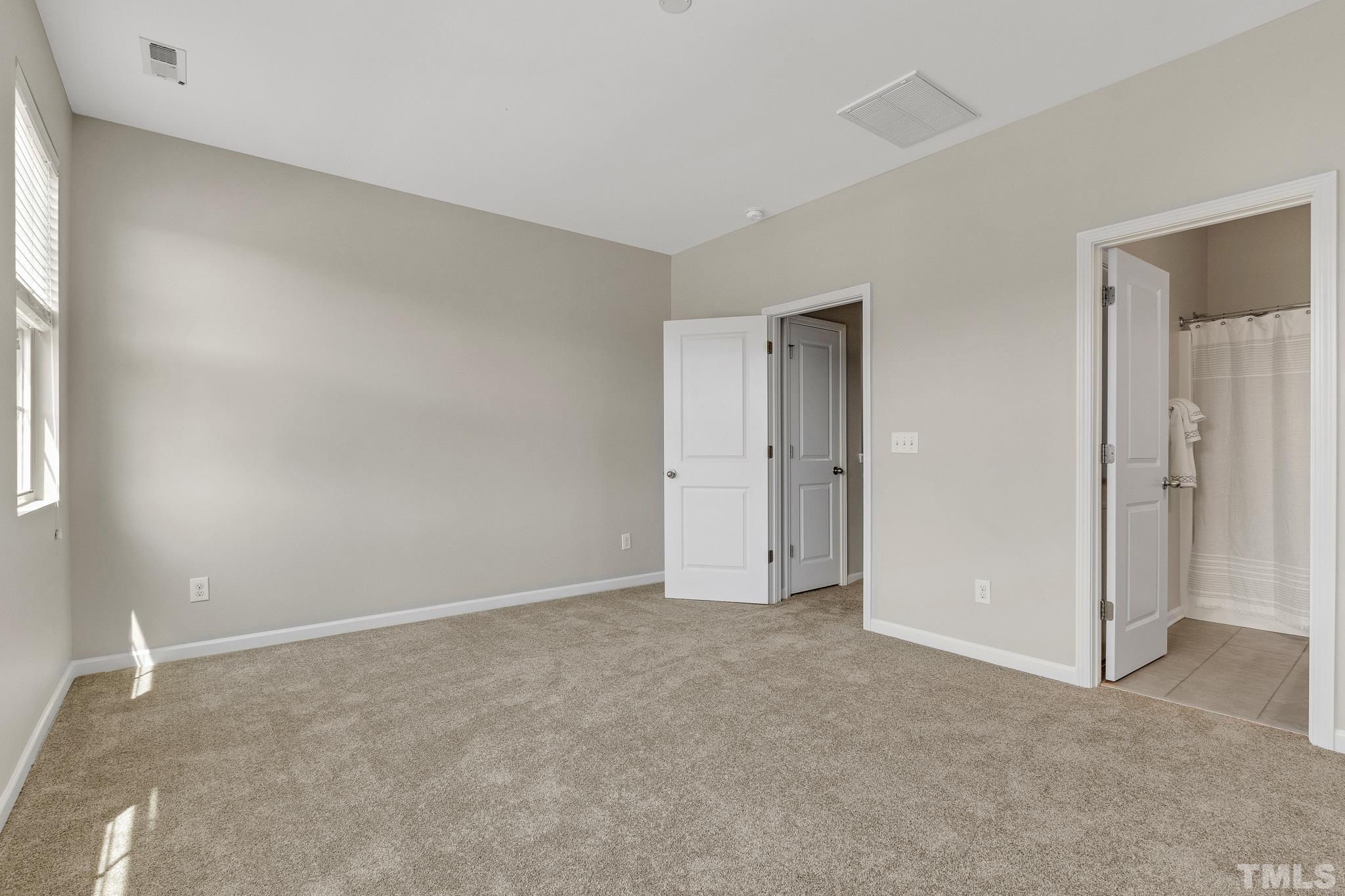 762 Wickham Ridge Road Apex, NC 27539 - Photo 25 of 32 a view of an empty room and window