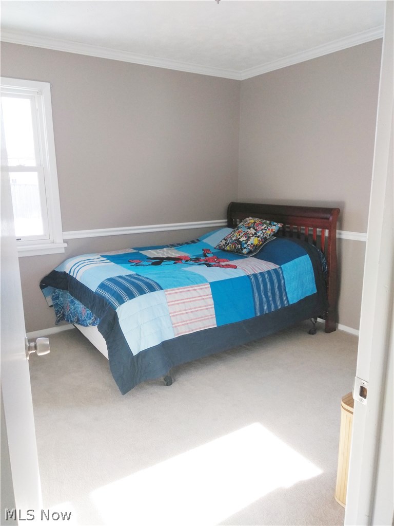 5065 Wake Robin Road Mentor, OH 44060 - Photo 9 of 24 Bedroom freshly painted with chair rail and crown molding.