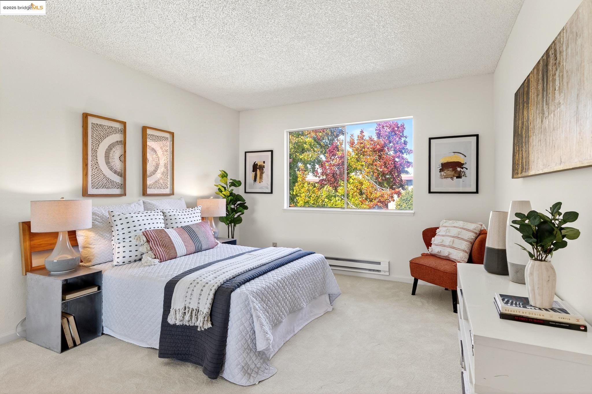 1311 Webster Street, Unit E316 Alameda, CA 94501 - Photo 24 of 39 a bedroom with a bed and a couch