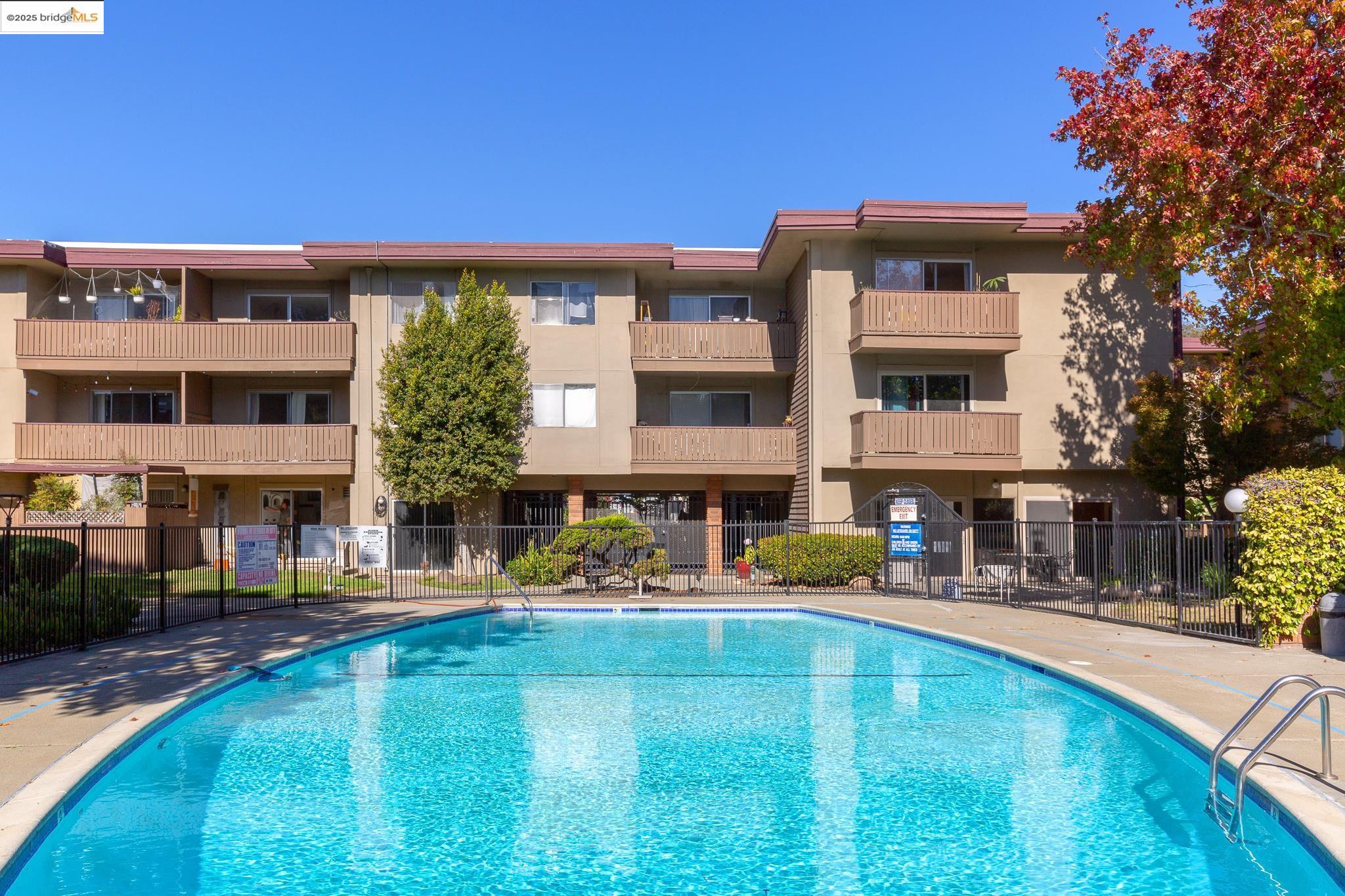 1311 Webster Street, Unit E316 Alameda, CA 94501 - Photo 27 of 39 a front view of a house with swimming pool