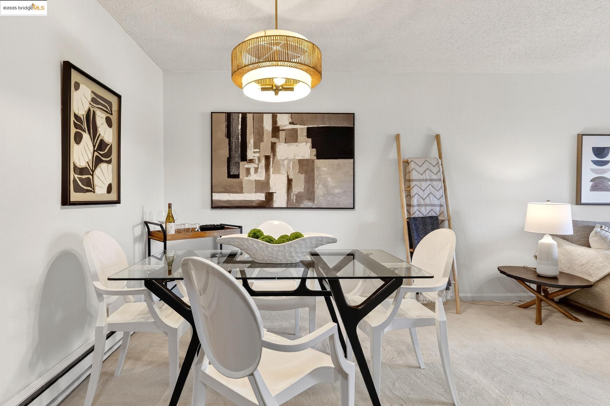 1311 Webster Street, Unit E316 Alameda, CA 94501 - Photo 10 of 39 a view of a dining room with furniture