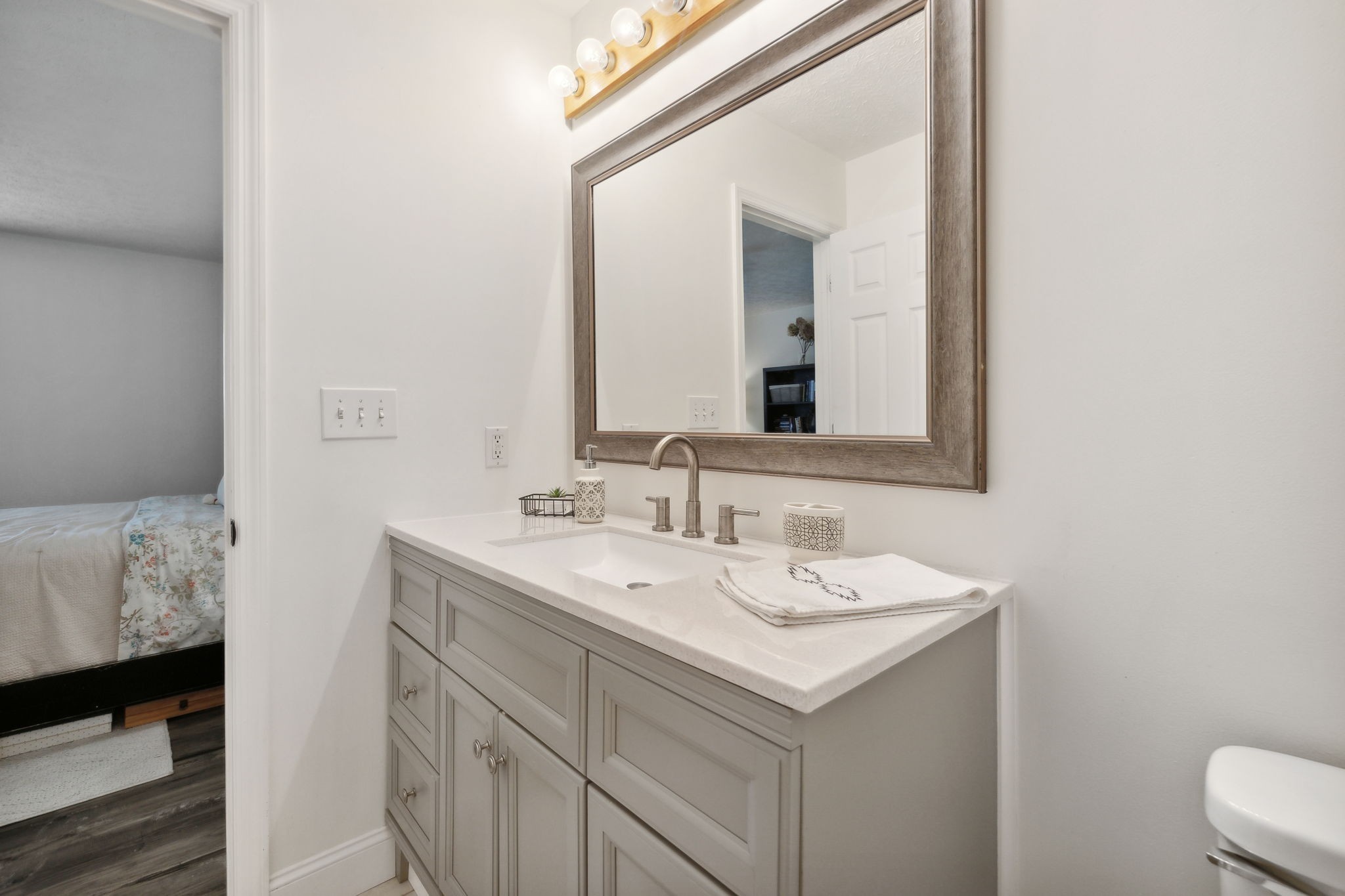 261 Tom Johnson Road Morrison, TN 37357 - Photo 14 of 40 a bathroom with a sink and a mirror