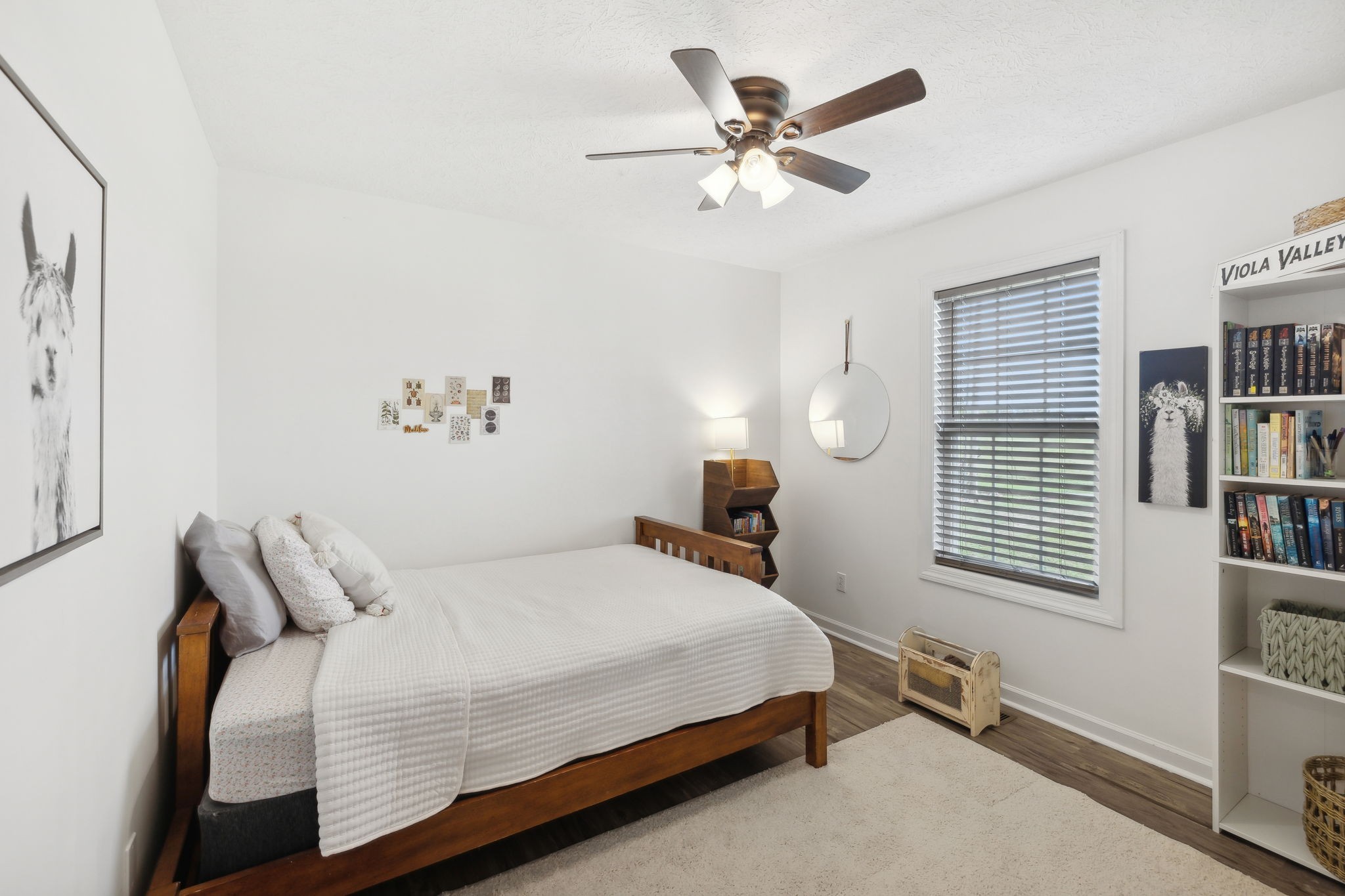 261 Tom Johnson Road Morrison, TN 37357 - Photo 17 of 40 a bedroom with a bed a window and a chandelier