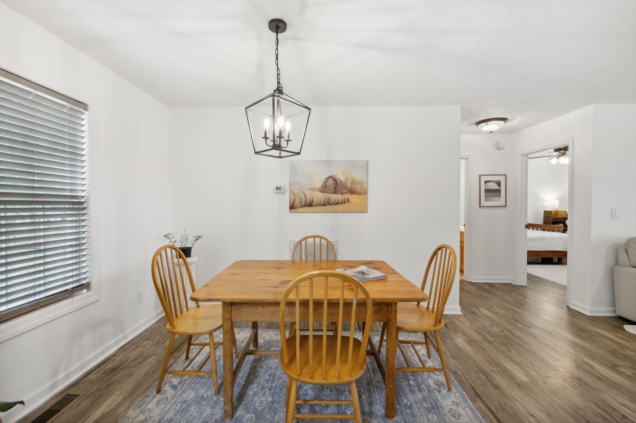 261 Tom Johnson Road Morrison, TN 37357 - Photo 20 of 40 a view of a dining room with furniture wooden floor and chandelier