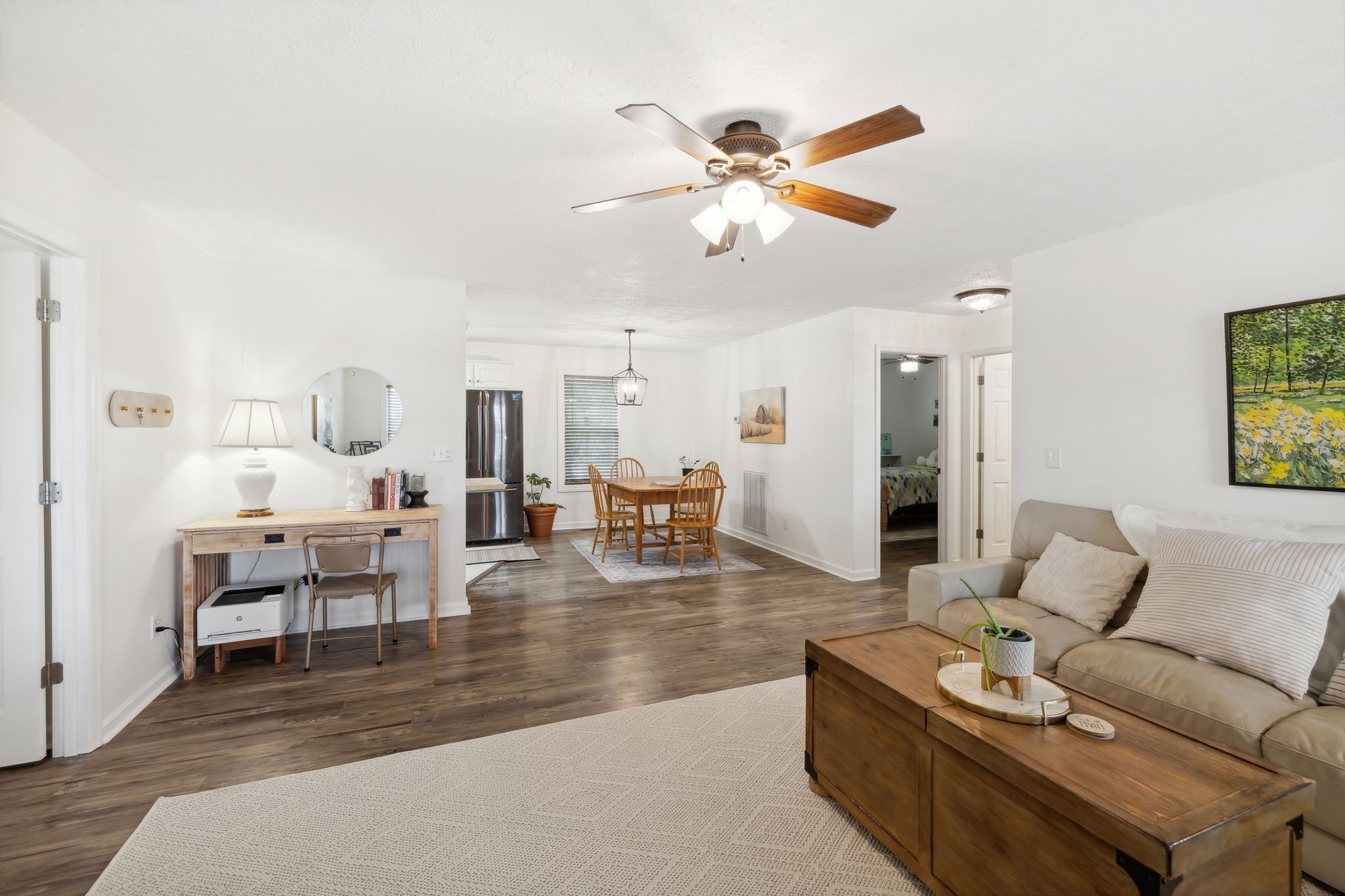 261 Tom Johnson Road Morrison, TN 37357 - Photo 7 of 40 a living room with furniture kitchen view and a wooden floor