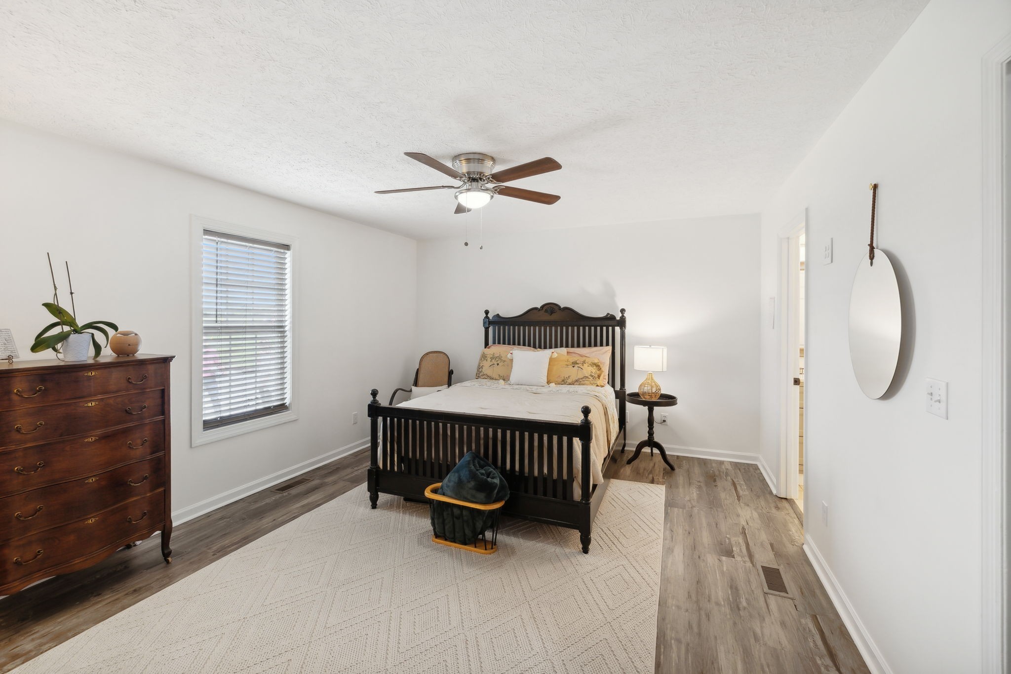 261 Tom Johnson Road Morrison, TN 37357 - Photo 8 of 40 a bedroom with a bed and a chandelier