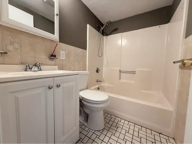 a balcony with wooden floor and fence