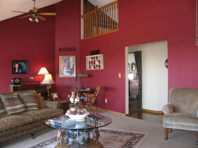 15228 East McNeal Road Monroe Center, IL 61052 - Photo 11 of 25 a living room with furniture and a lamp