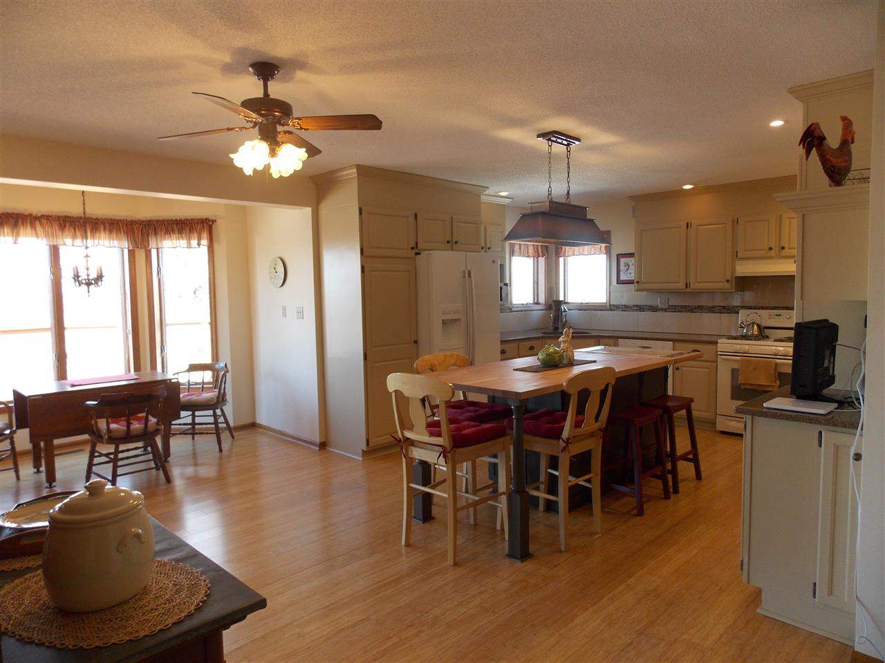 15228 East McNeal Road Monroe Center, IL 61052 - Photo 5 of 25 a view of a dining room with furniture window and wooden floor