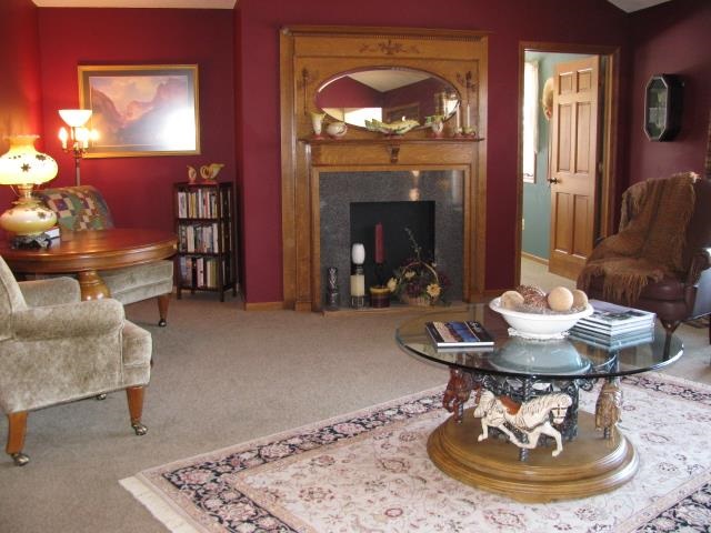 15228 East McNeal Road Monroe Center, IL 61052 - Photo 10 of 25 a living room with furniture and a fireplace