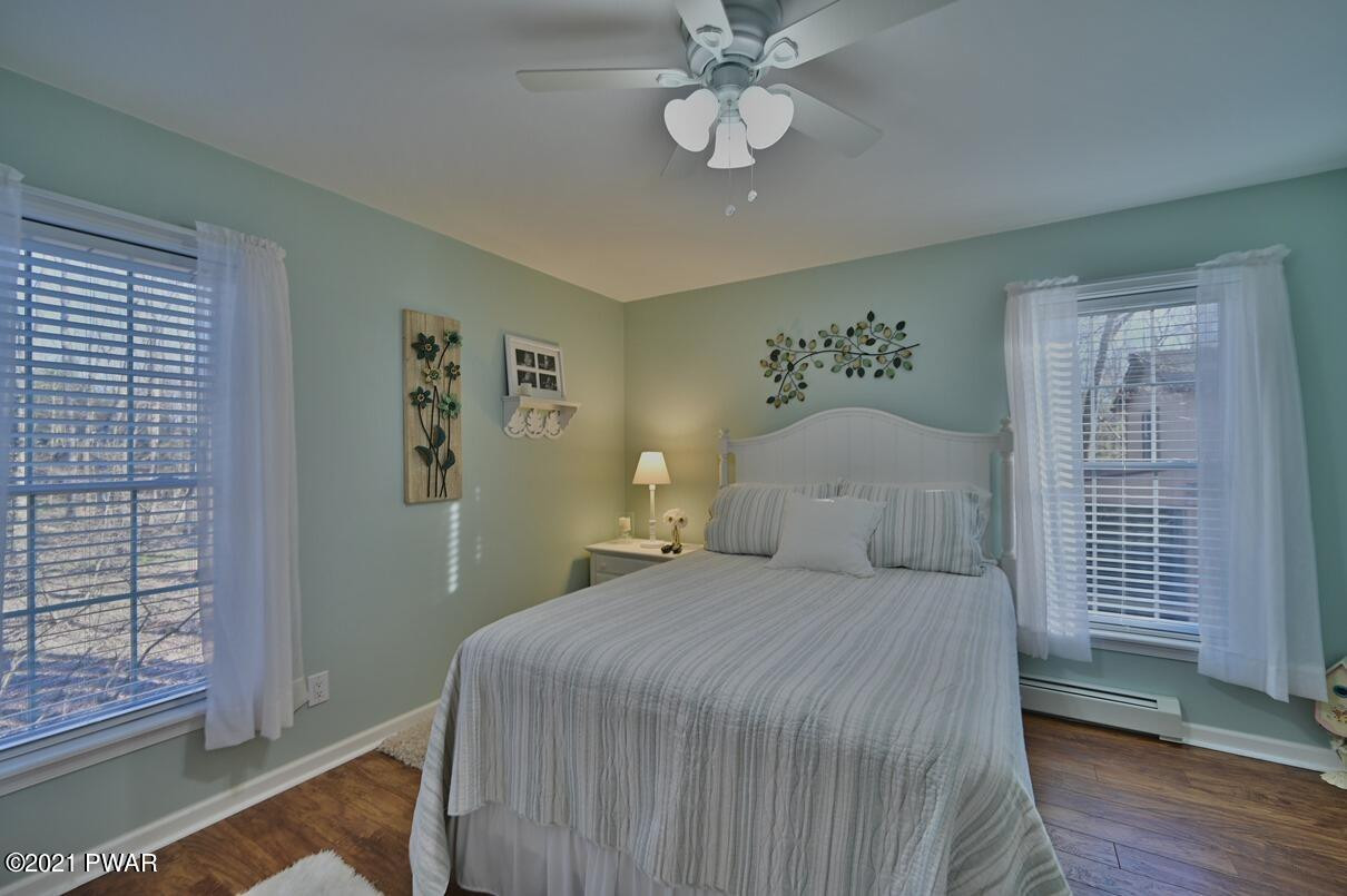 76 Rockway Road Lake Ariel, PA 18436 - Photo 39 of 101 a bedroom with a large bed and a window