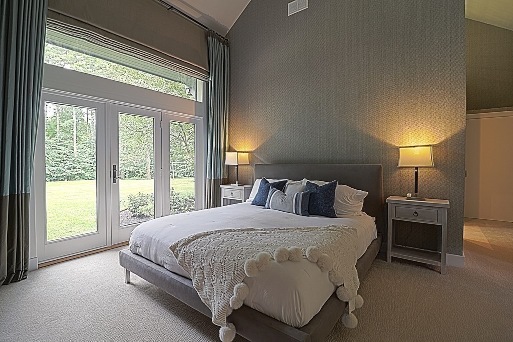 6 Sutton Place Acton, MA 01720 - Photo 11 of 24 a bedroom with a bed and a large window