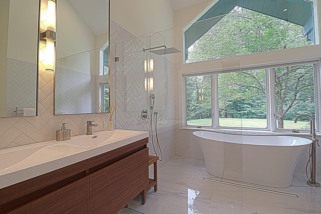 6 Sutton Place Acton, MA 01720 - Photo 12 of 24 a bathroom with a sink and a bathtub