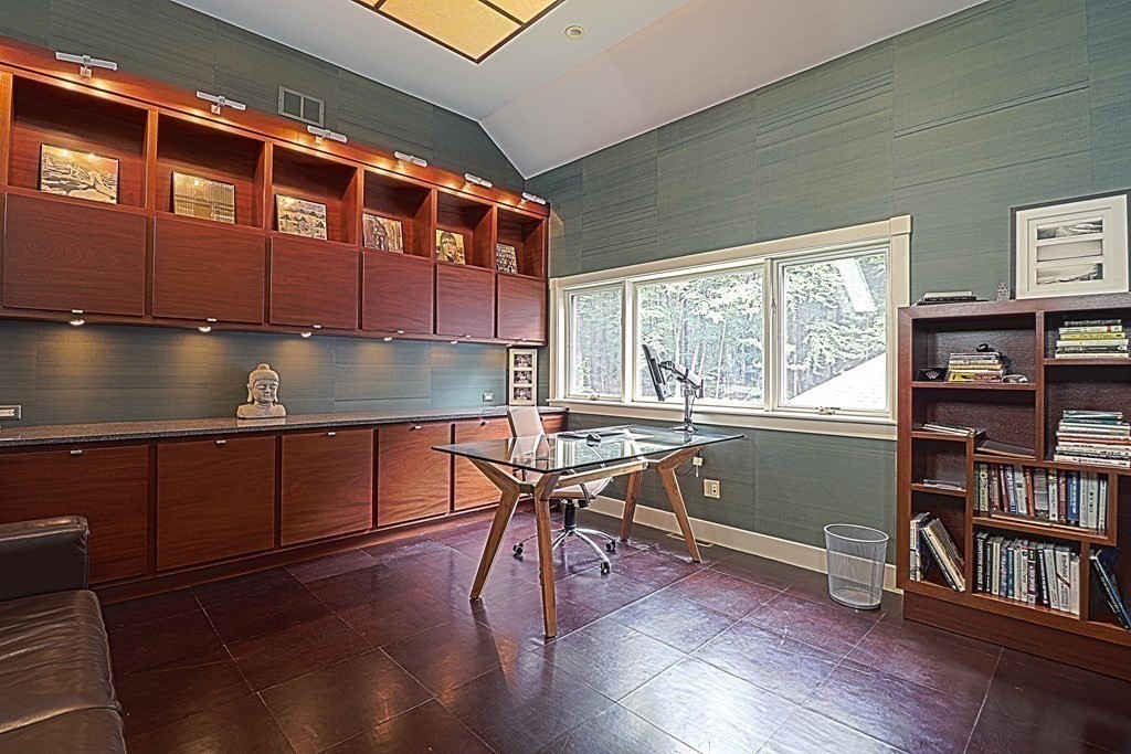 6 Sutton Place Acton, MA 01720 - Photo 15 of 24 a kitchen with granite countertop lots of wooden cabinets a sink and a window