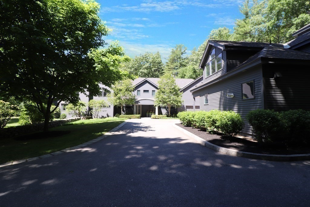 6 Sutton Place Acton, MA 01720 - Photo 24 of 24 a front view of a house with garden