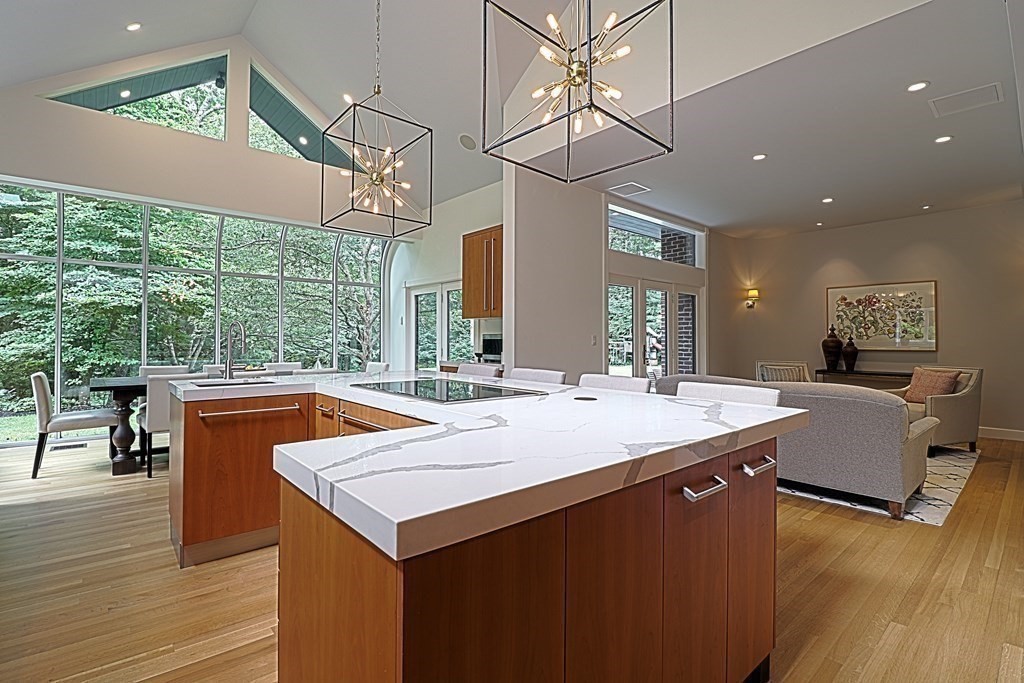 6 Sutton Place Acton, MA 01720 - Photo 3 of 24 a view of living room with granite countertop furniture and a floor to ceiling window