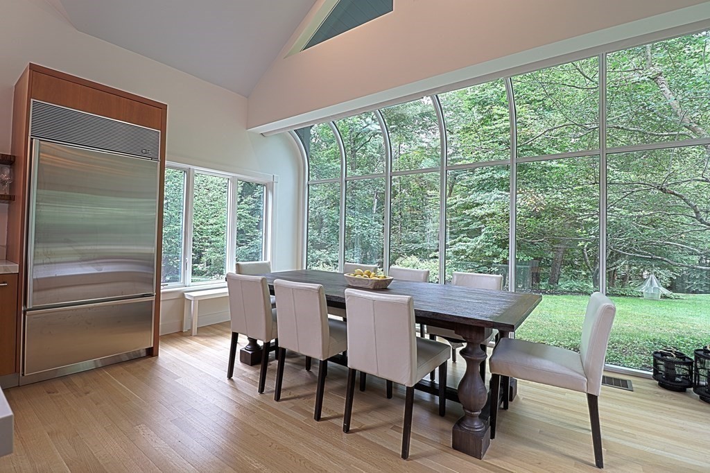 6 Sutton Place Acton, MA 01720 - Photo 4 of 24 a view of a dining room with furniture window and wooden floor