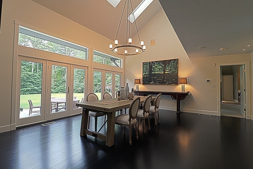 6 Sutton Place Acton, MA 01720 - Photo 6 of 24 a view of a dining room with furniture window and wooden floor